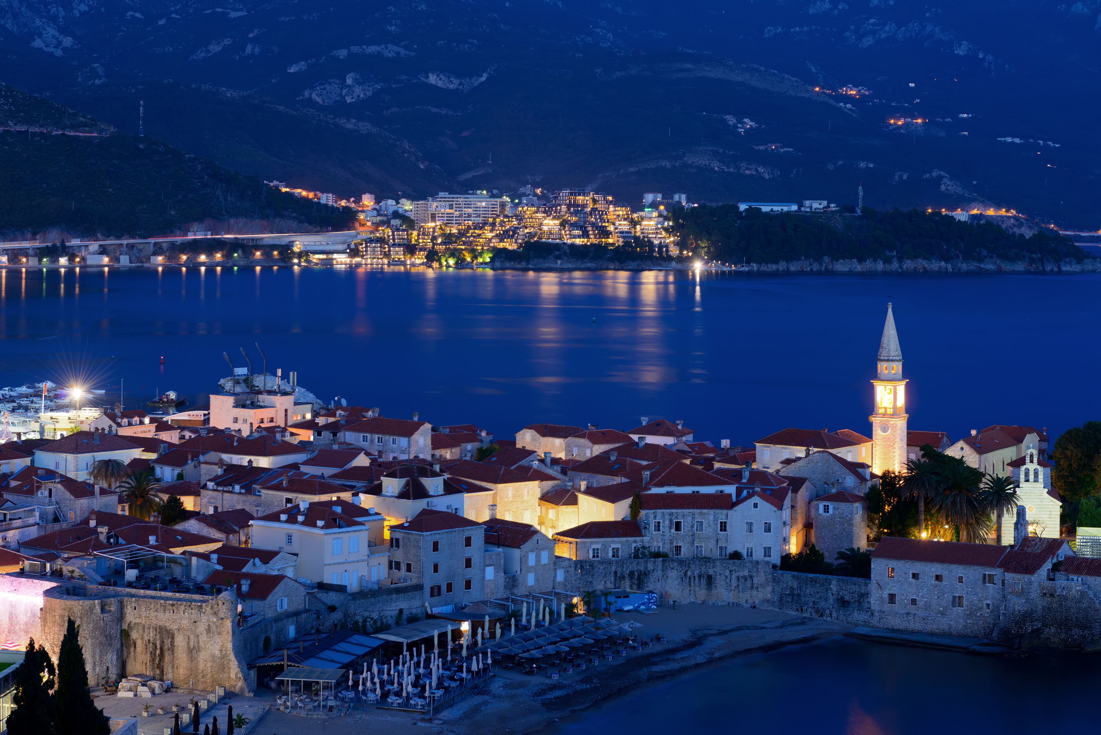 Budva city and bay at night
