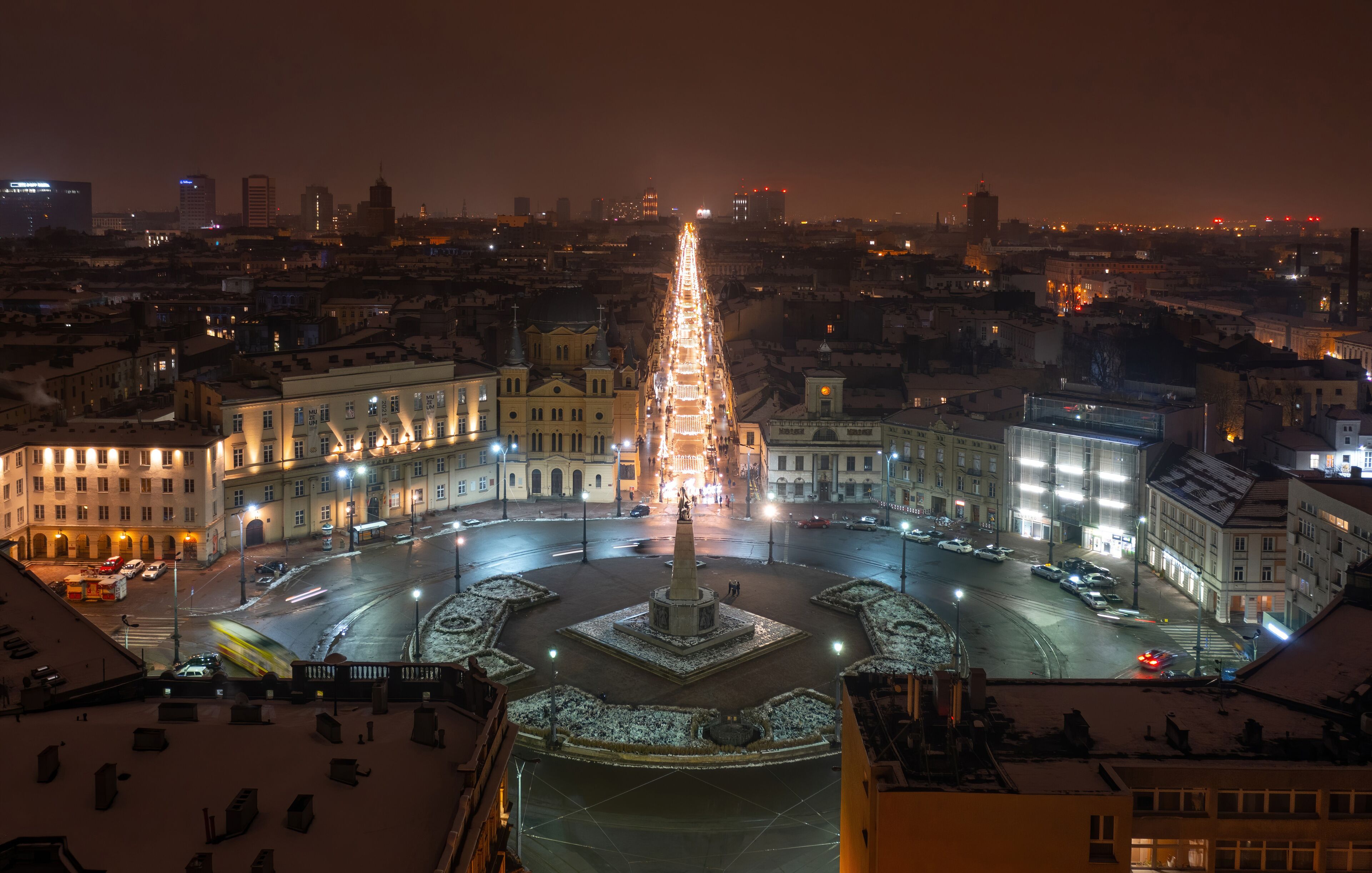 Aerial night winter view above Independence square and Piotrkowska street in Łódź, Poland