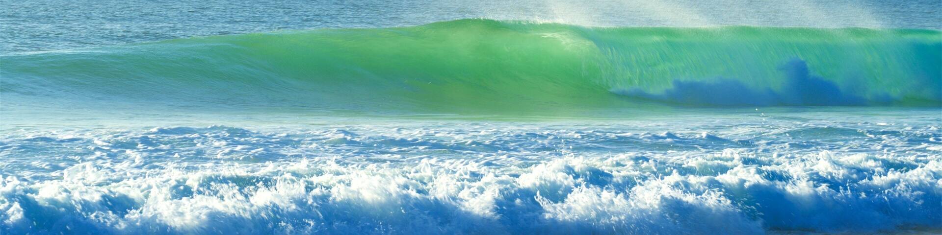 Supertubos Beach which includes surf, general coastal views and a coastal town