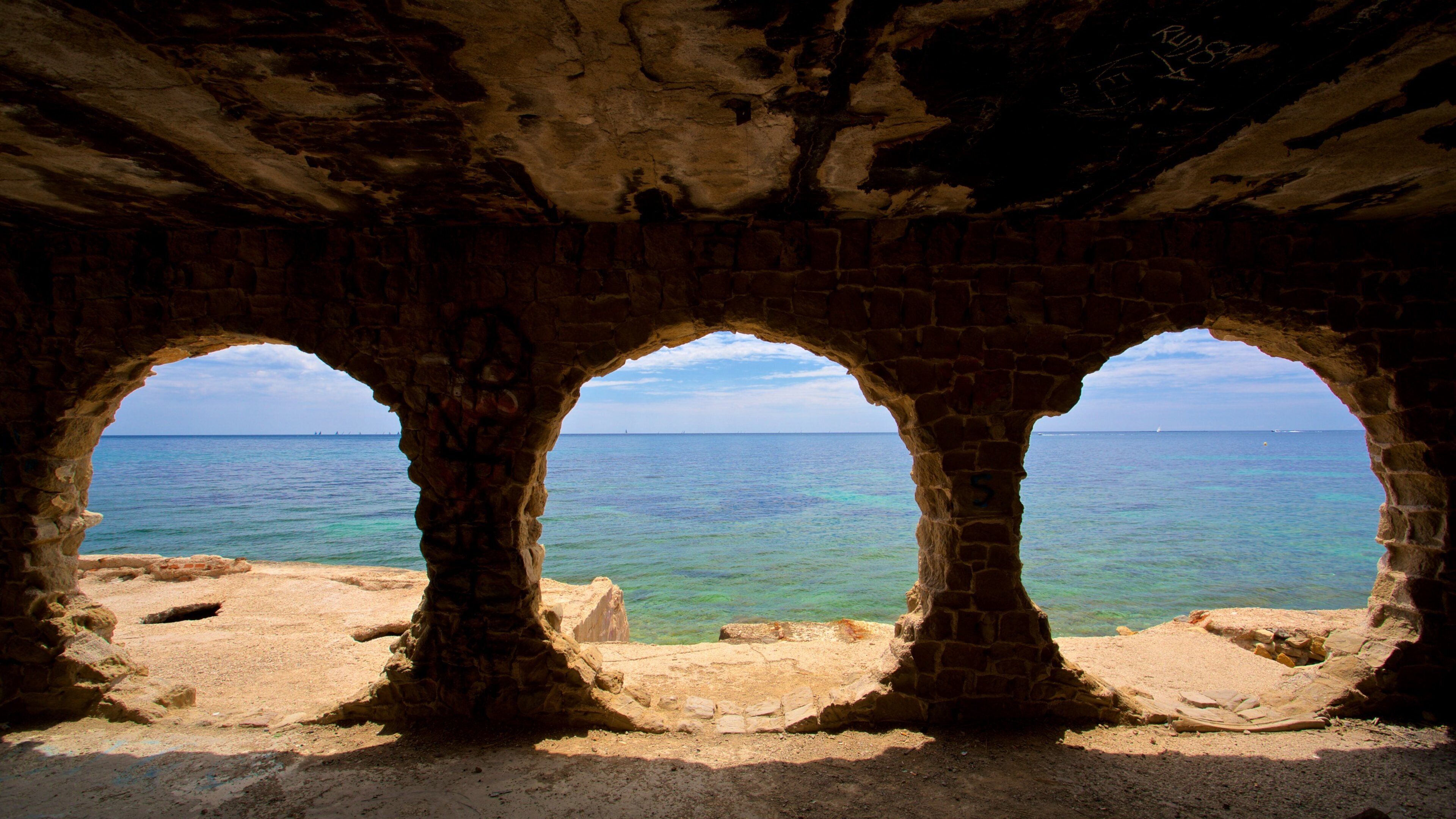 Cala La Manzanera which includes general coastal views and heritage elements