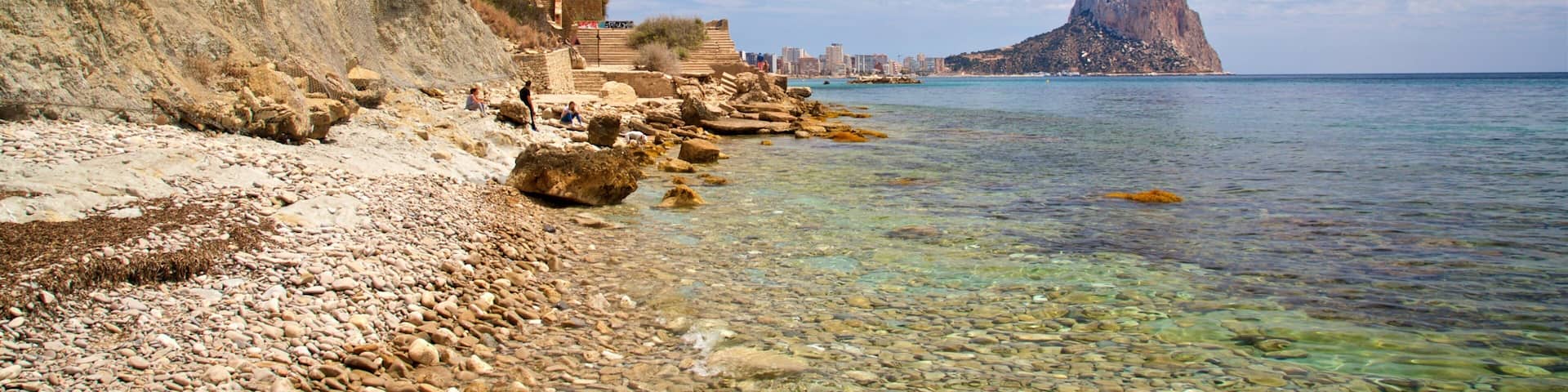 Cala La Manzanera featuring rugged coastline, general coastal views and a pebble beach