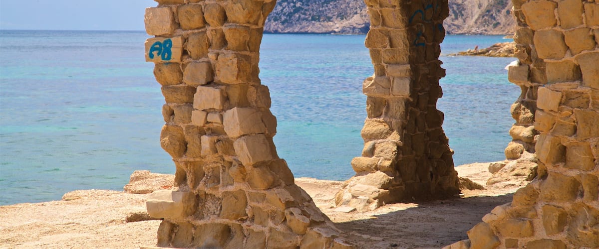 Cala La Manzanera which includes general coastal views and heritage elements