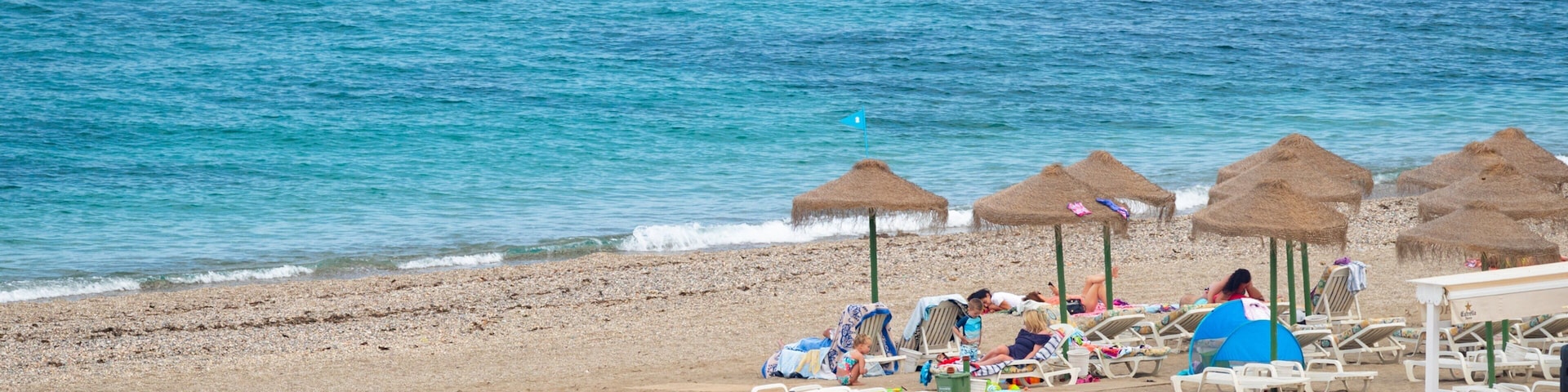 El Castillo Beach which includes a beach and general coastal views