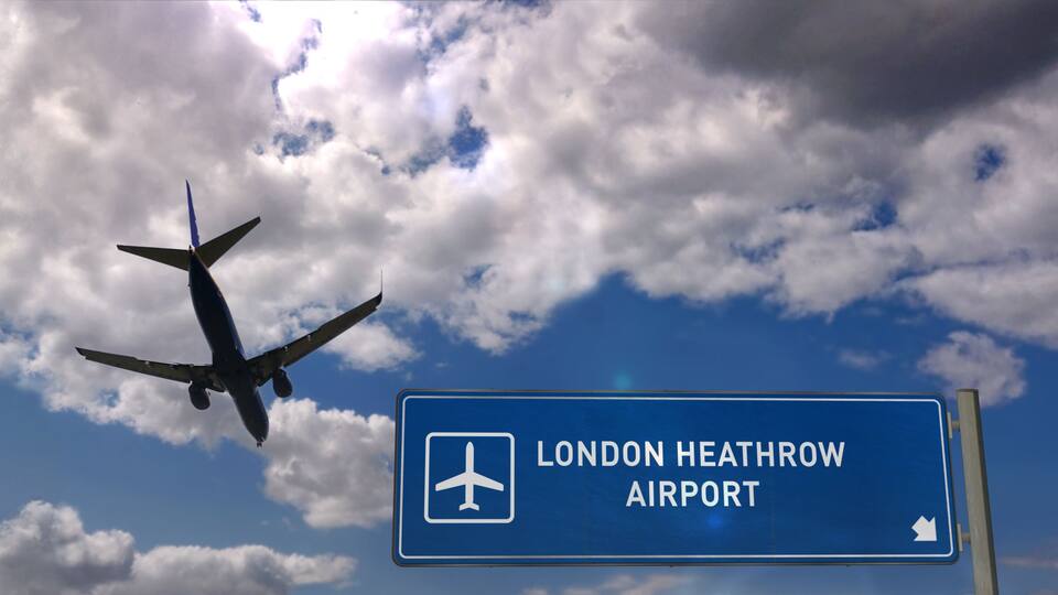Plane landing in London Heathrow with signboard