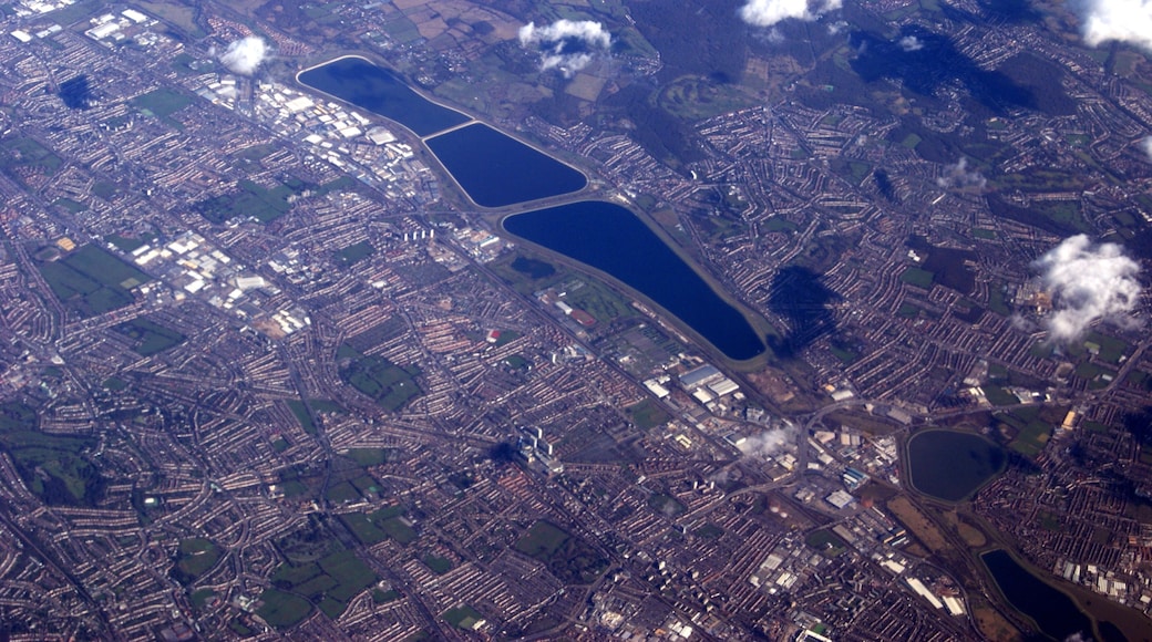 An ariel picture showing part of North London including Edmonton, Ponders End, Brimsdown, Chingford and several reservoirs in the Lee Valley Reservoir Chain. From the top of the photo are the twin basins of the King George V reservoir adjacent to the William Girling reservoir, the circular Banbury Reservoir close by to the Lockwood Reservoir. A section of Epping Forest can be seen to the top right of the photograph