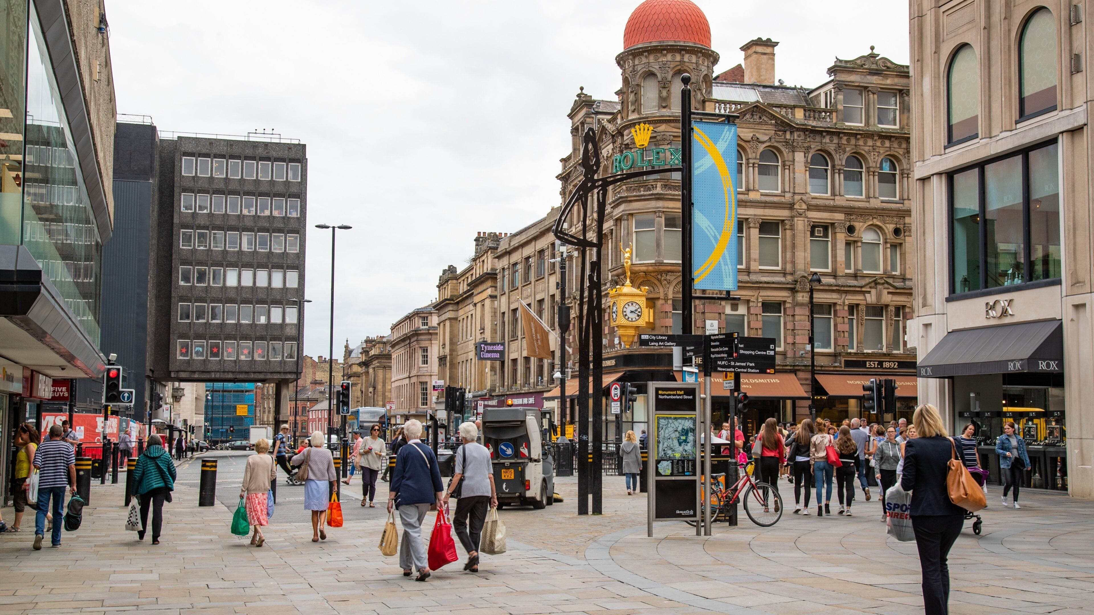 Newcastle City Center which includes street scenes as well as a large group of people