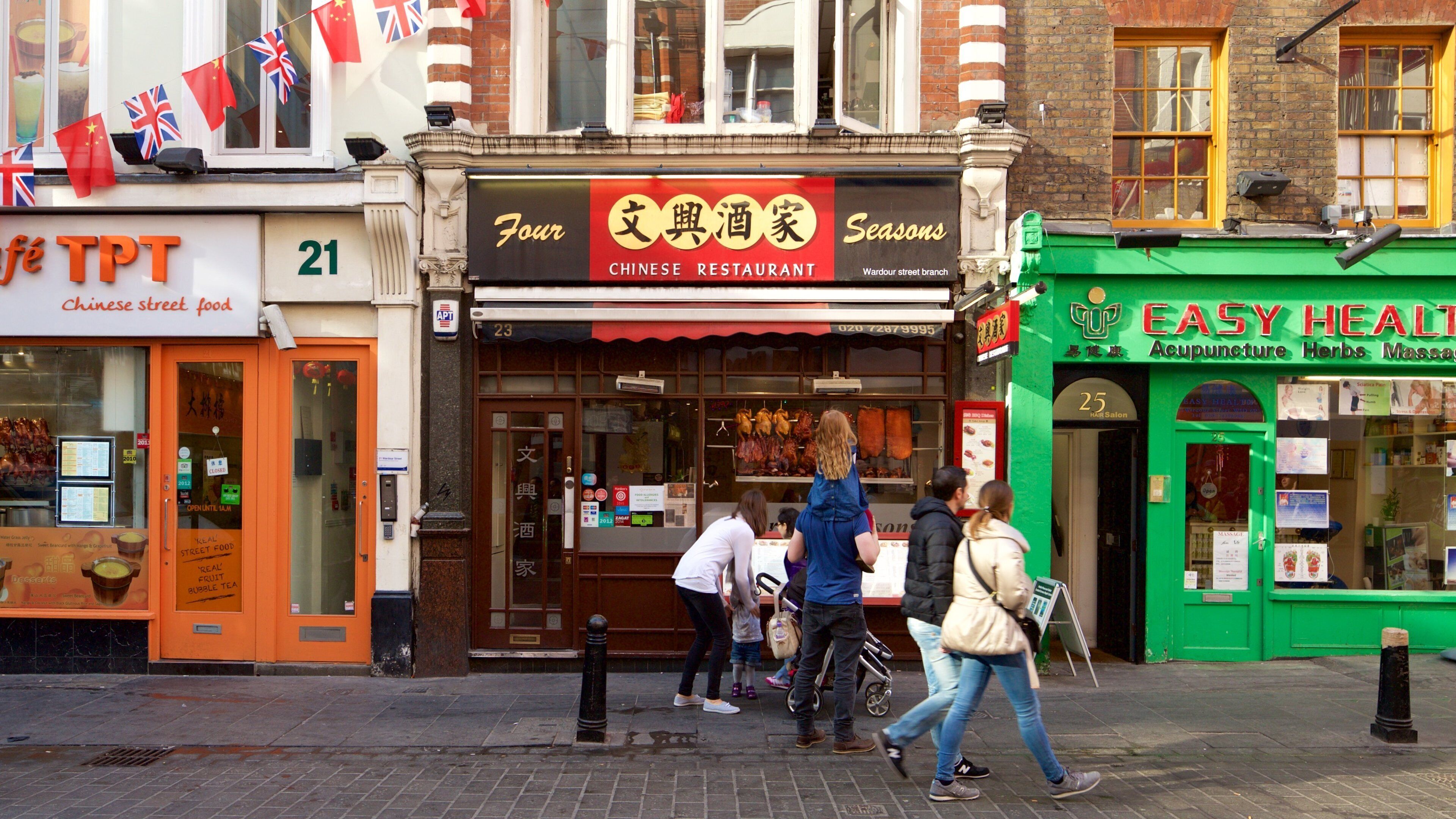 Chinatown which includes signage and street scenes as well as a family