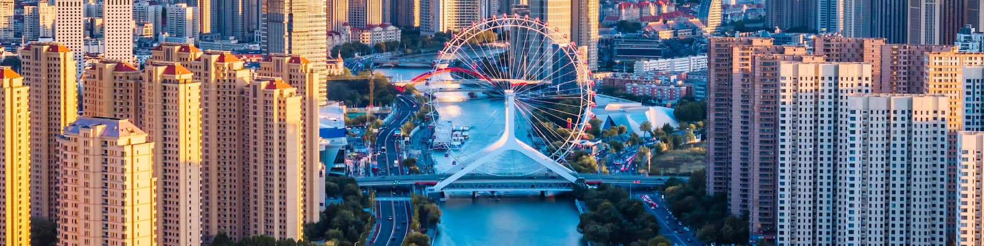 Aerial telephoto view of the skyline of Tianjin Eye Ferris Wheel on the Haihe River in Tianjin, China
