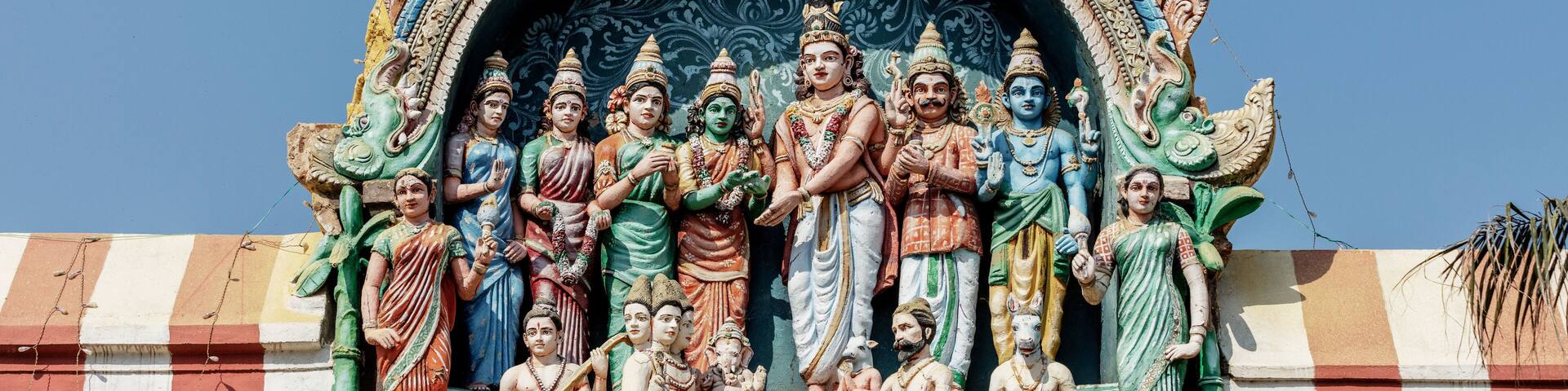 God Shiva weds Parvathi in the presence of Vishnu, Bramah, Naradha and other rishis. An excellent detailed sculpture made out of lime mortar at ancient Perur shiva temple in Coimbatore, Tamilnadu.