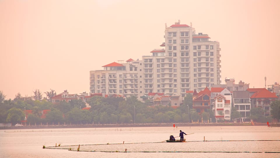 Tay Ho which includes a sunset and a river or creek