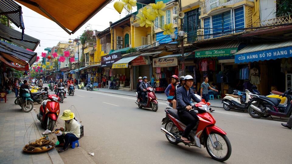 Hoan Kiem showing street scenes, a city and motorcycle riding