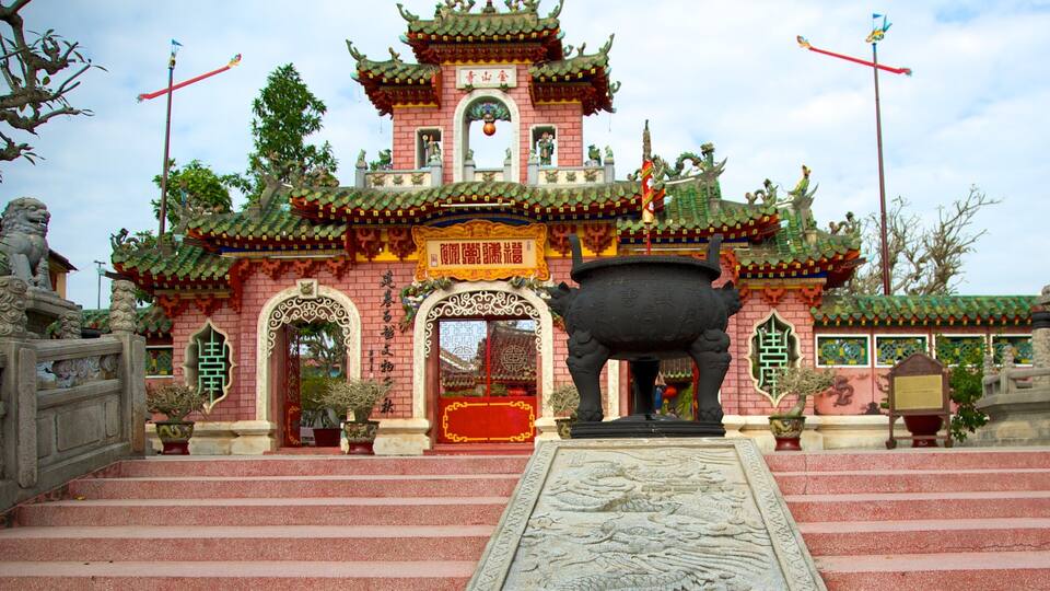 Minh An featuring a temple or place of worship and heritage architecture