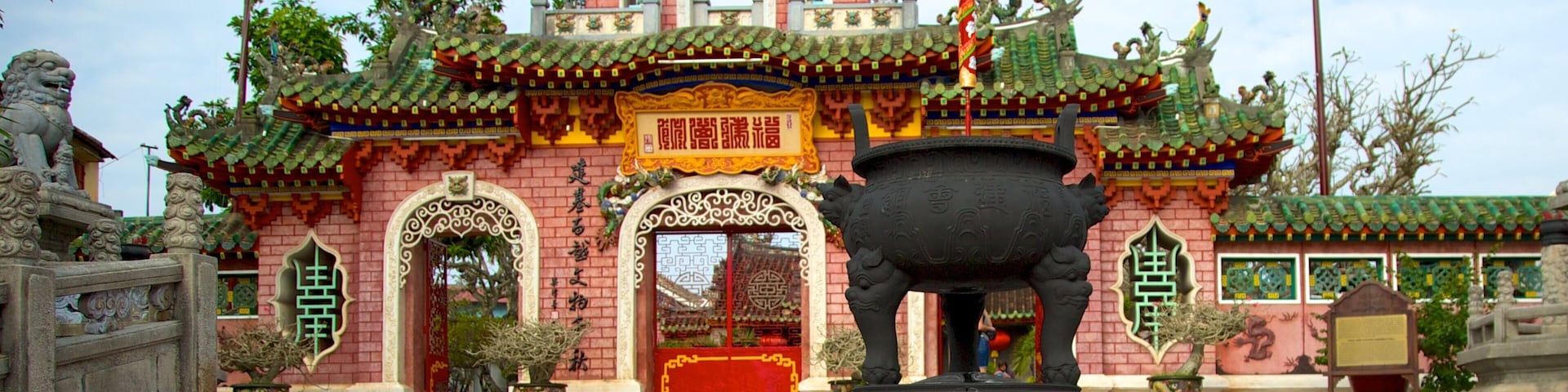 Minh An featuring a temple or place of worship and heritage architecture