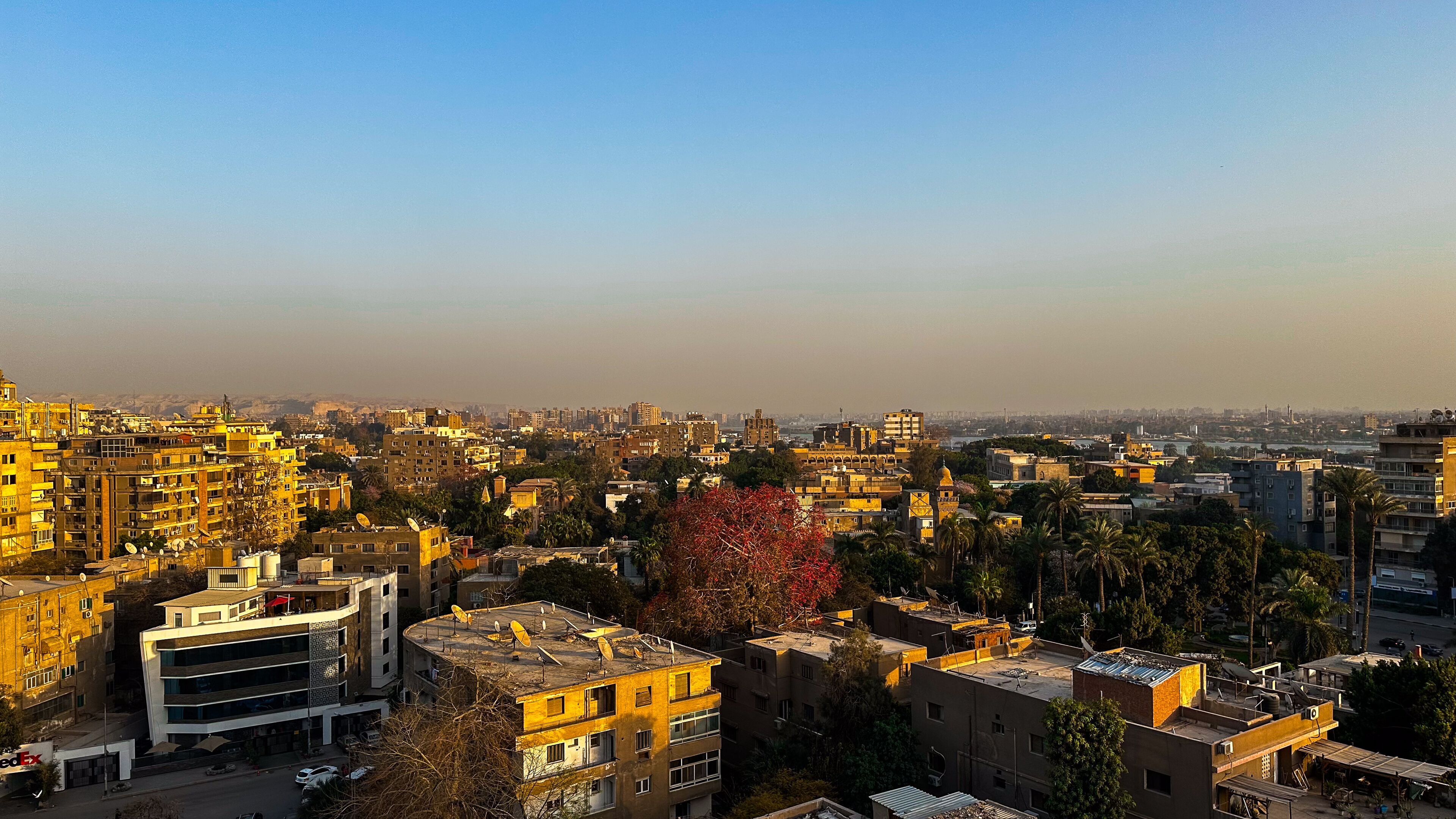 Beautiful orange sunset in the Cairo, Egypt. View from the rooftop on the Maadi district 