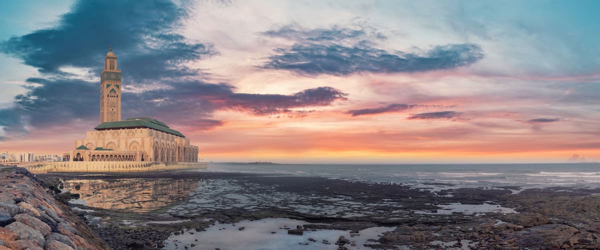 Casablanca, Morocco -April 2023: The Hassan II Mosque during sunset. Impressive architecture and intricate details showcase the country's rich cultural heritage and religious devotion.