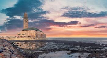Casablanca, Morocco -April 2023: The Hassan II Mosque during sunset. Impressive architecture and intricate details showcase the country's rich cultural heritage and religious devotion.