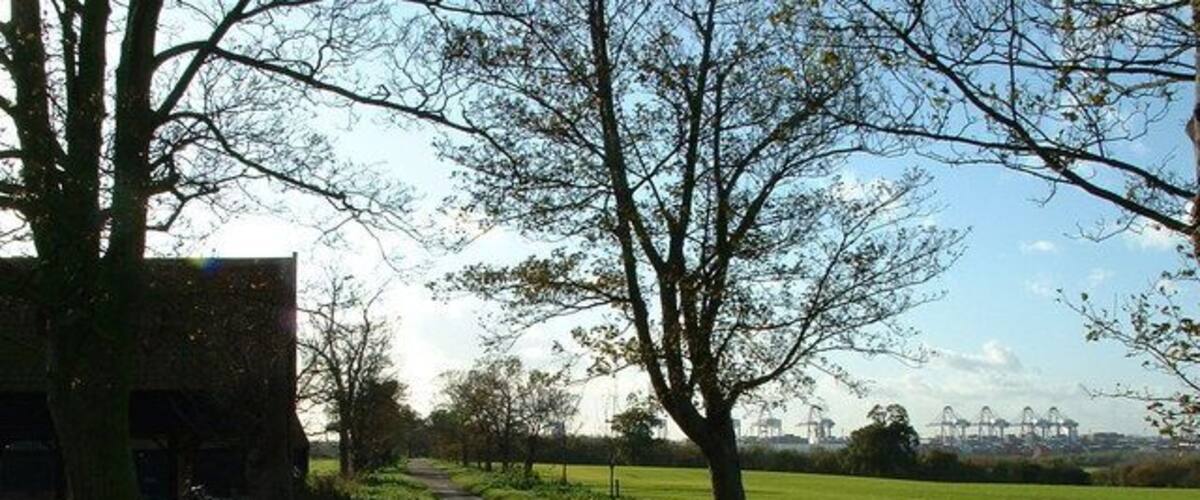 Entrance to Trimley Marshes The entrance to Trimley Marshes with Felixstowe docks in the background.