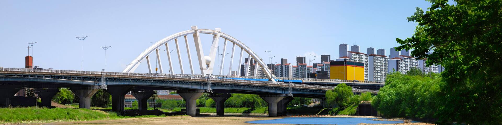 Gwangju City panoramic green space landscape at Geukrakgang River, the branch of Yeongsan River, with Mujingyo Bridge in Jeollanam‑do, South Korea