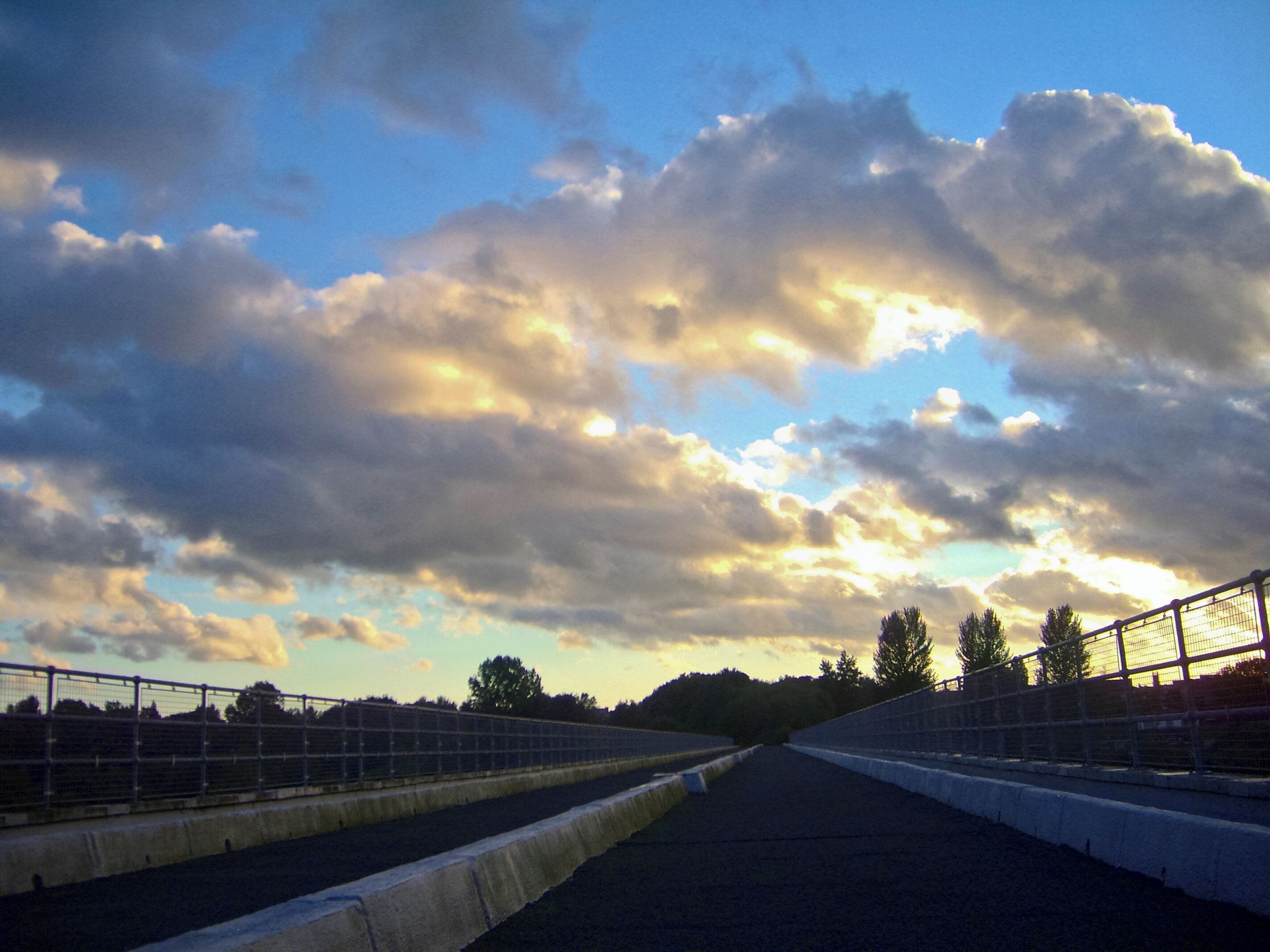 A racetrack with a clear sky and clouds.
