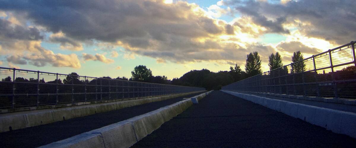 A racetrack with a clear sky and clouds.
