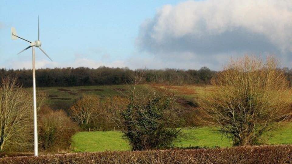 Winscombe Fields & Hedges Taken just after midday on Christmas Day 2008, look - a rare moment of blue sky! The small turbine is situated at the back of Winscombe Primary School playing fields, the first school to have one in North Somerset (see link). The woods on the horizon are situated near the dis-used Sandford Quarry. http://www.thewestonmercury.co.uk/content/twm/news/story.aspx?brand=westonmercury&category=news&tBrand=westonmercury&tCategory=znews&itemid=WeED23%20Jan%202009%2015%3A28%3A32%3A017