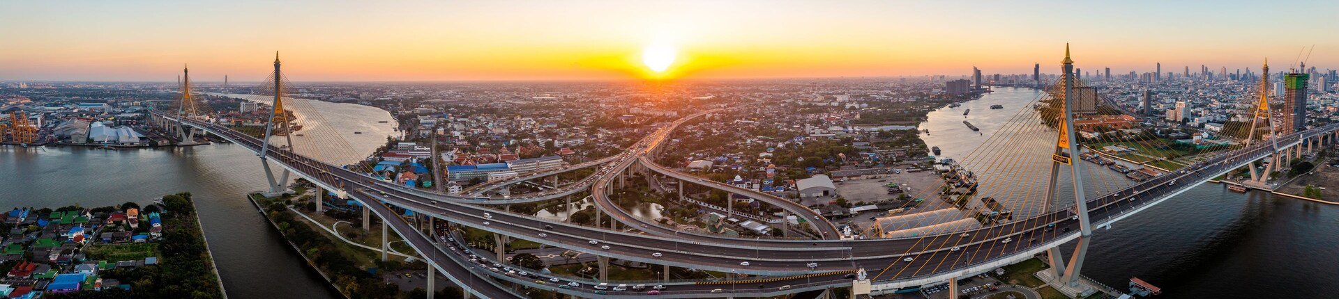 Un paisaje urbano con un puente destacado y un río.
