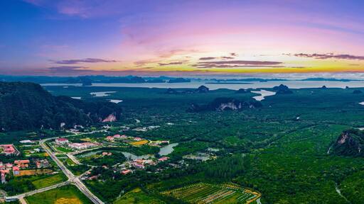 Scenic panorama landscape of phang nga Thailand at sunset with lush greenery and limestone formations