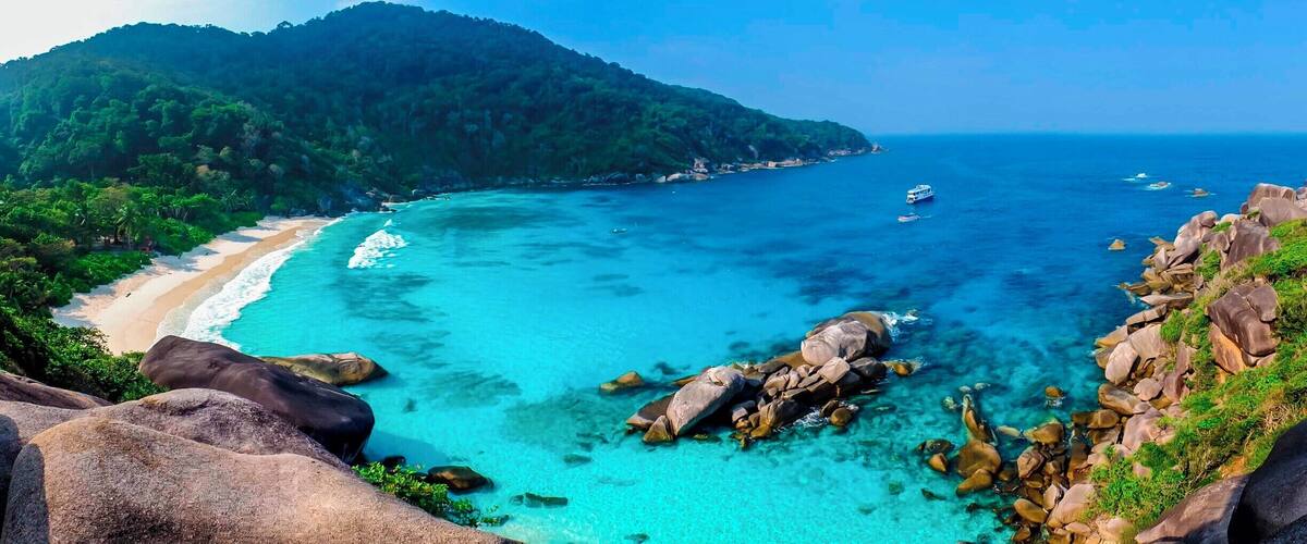 During a 4 day Scuba Diving Live-aboard trip at the Similan Islands, we had a chance to relax for a few hours in this beautiful bay with the stunning beach. The picture was taken just below a huge rock that resembles a sail. So the island is often referred to Sail Rock Island.
#EndlessSummer
