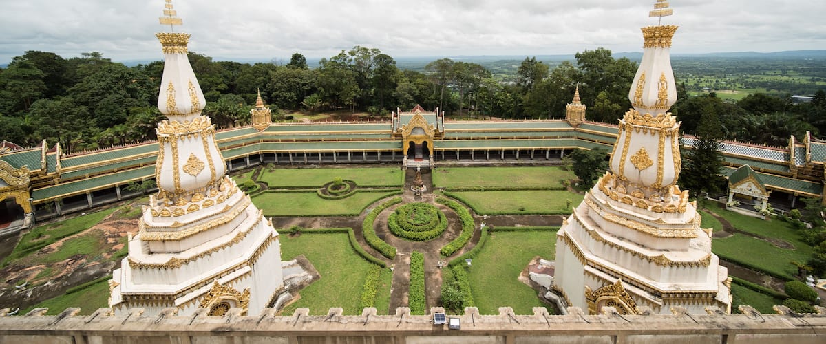 A grand temple complex with ornate golden spires and a symmetrical layout.