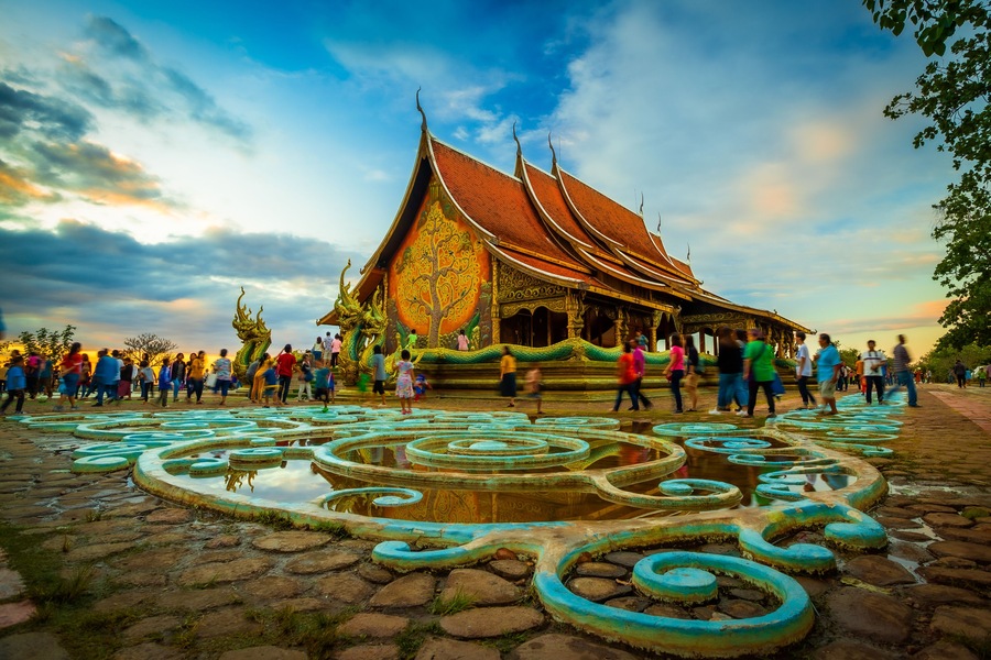 Thais bring families to visit Sirinthorn Wararam Phupha Temple (Wat Phu Phrao) in the evening. Very beautiful temples near the Thai-Lao border town of Chong Mek in Sirindhorn district, Ubon Ratchathan