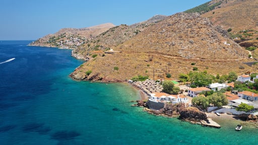 Aerial drone photo of small beach of Vlycho with clear turquoise sea in picturesque island of Ydra or Hydra, Saronic gulf, Greece