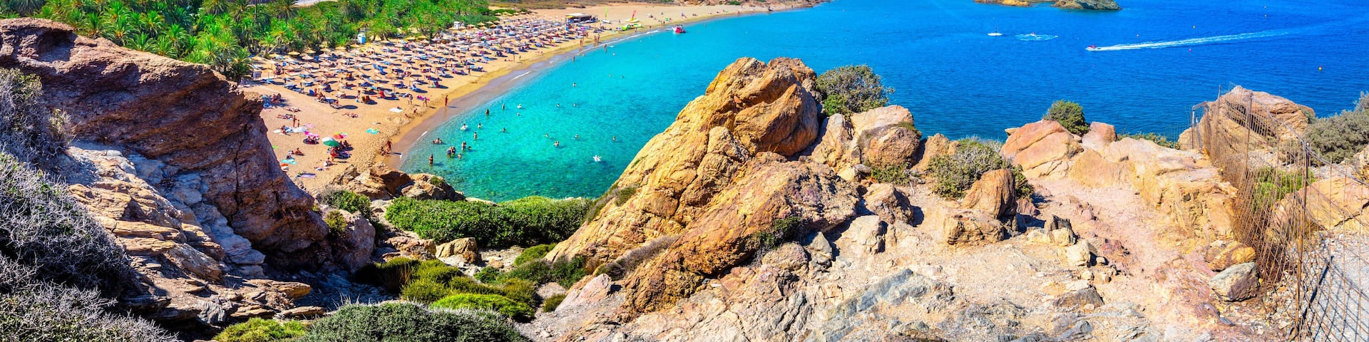 Scenic landscape of palm trees, turquoise water and tropical beach, Vai, Crete, Greece.