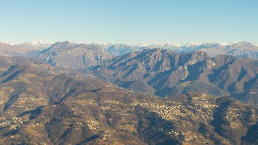 Great landscape with fantastic blue sky on the Orobie Alps and Padana plain a dry winter season without snow. Panorama from Linzone Mountain, Bergamo, Italy.