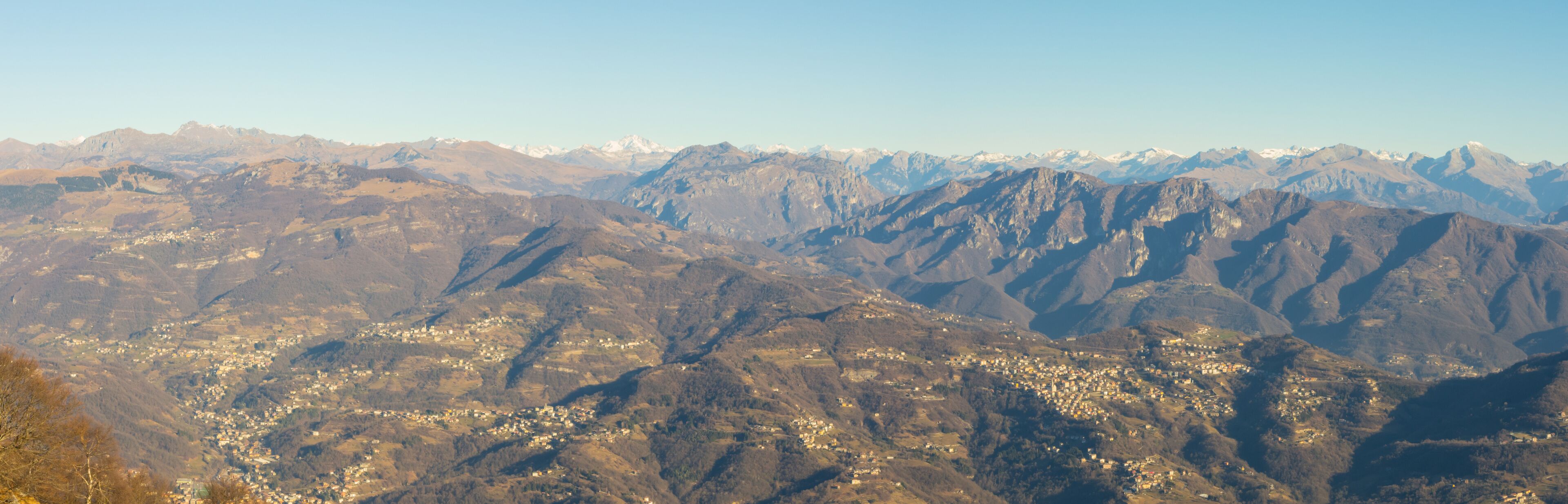 A mountainous landscape with a town nestled in the valley.