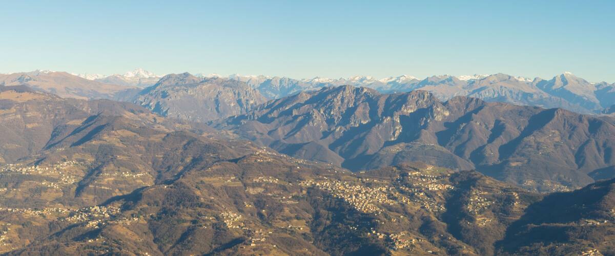 A mountainous landscape with a town nestled in the valley.