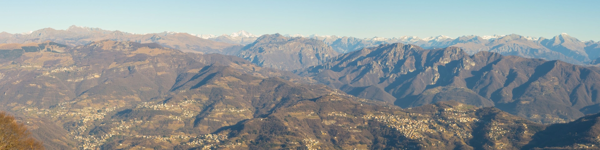 A mountainous landscape with a town nestled in the valley.