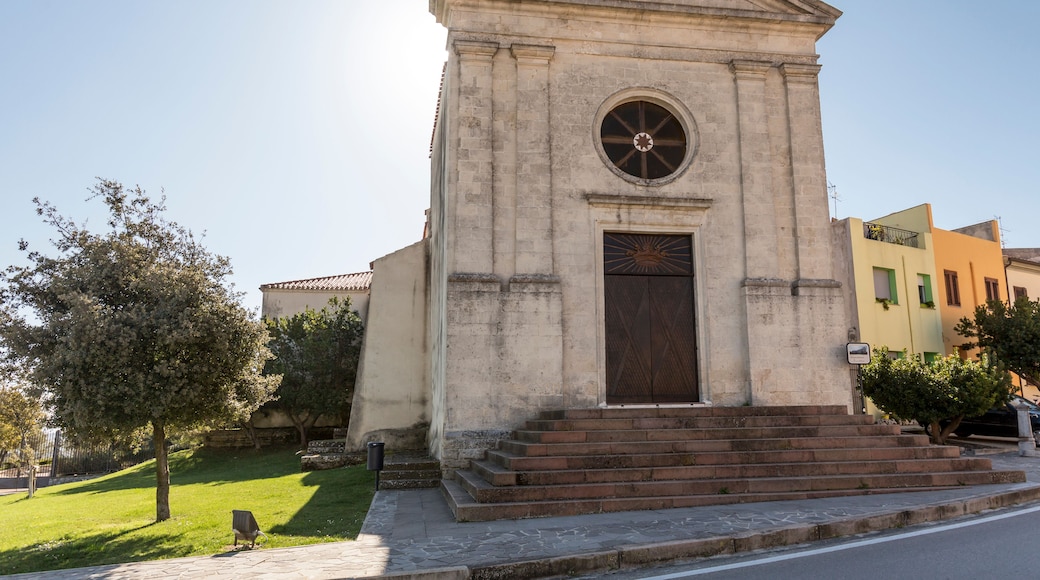 A historic building with a central dome, a large door, and steps leading up to it.
