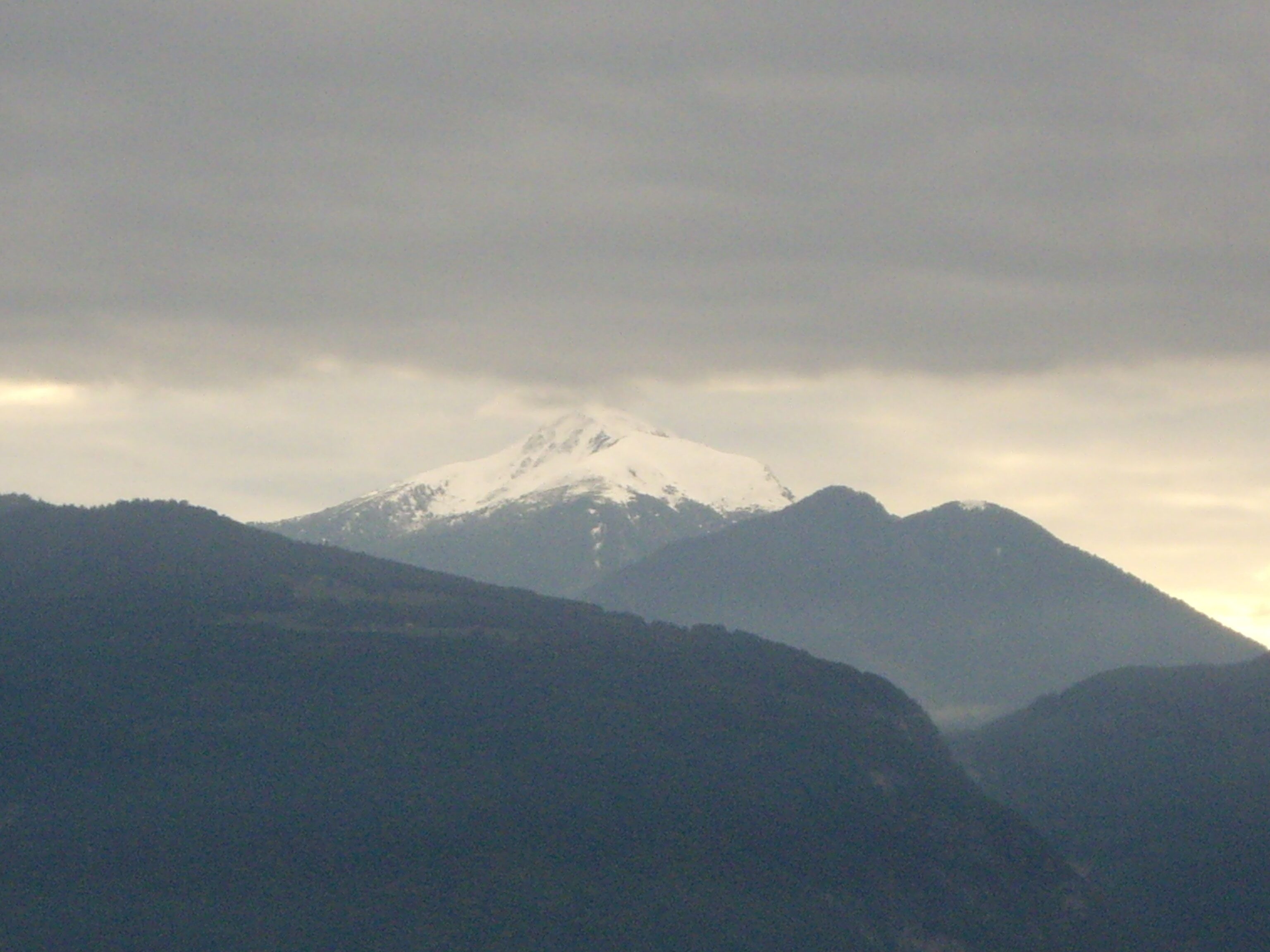 View at some mountain from Monticolo Lake southwest. Dolomites, Italy.
