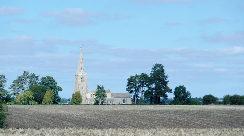 View across a field to All Saints parish church, Little Staughton, Bedfordshire