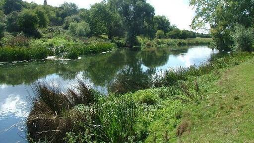 The Great Ouse near Harold. you can see the spire to St Nicholas's Church