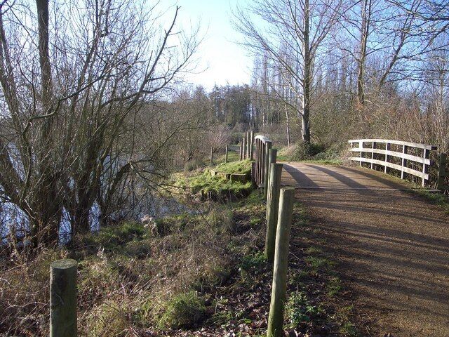 Footpath & Bridge in Harrold Odell Country Park There is a public footpath all the way around the principal pond within the Country Park which is a highly popular spot for walkers and for recreational use. This bridge takes the footpath over a lateral drainage ditch on the north-western side of the park.