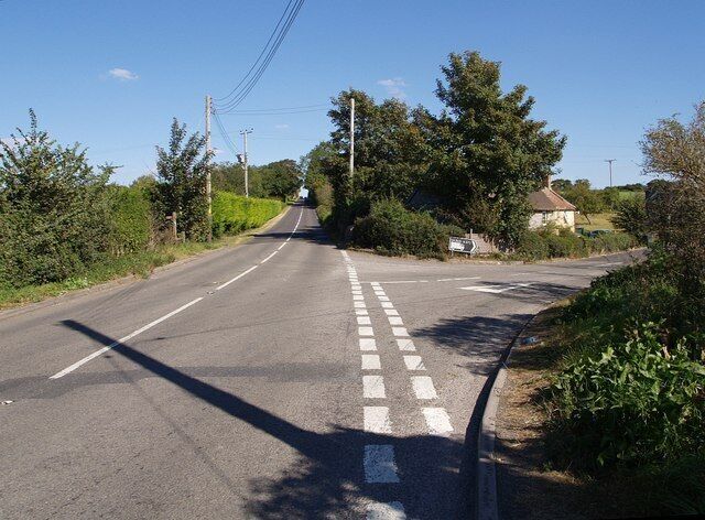 B3153 at Tengore Lane. The junction referred to in 560542; the B road is heading from Langport to Somerton and the side road links across to the A372 and thence the A303. Bridge Cottages are in the angle between the roads.