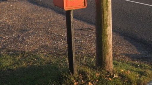 Postbox near Ringshall Very close to gridline, but looking into the square.