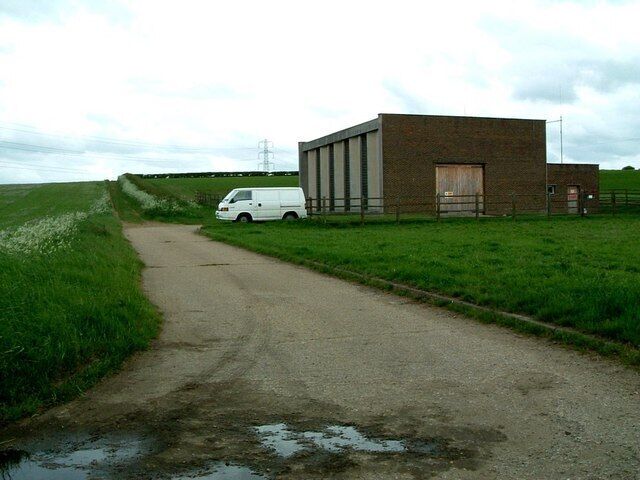 Pumping Station, Steppingley. ... and a white van. Not one of the fine Victorian Gothic pumping stations - more Brutalist really ! The track continuing on past the pumping station is part of the John Bunyan Trail.