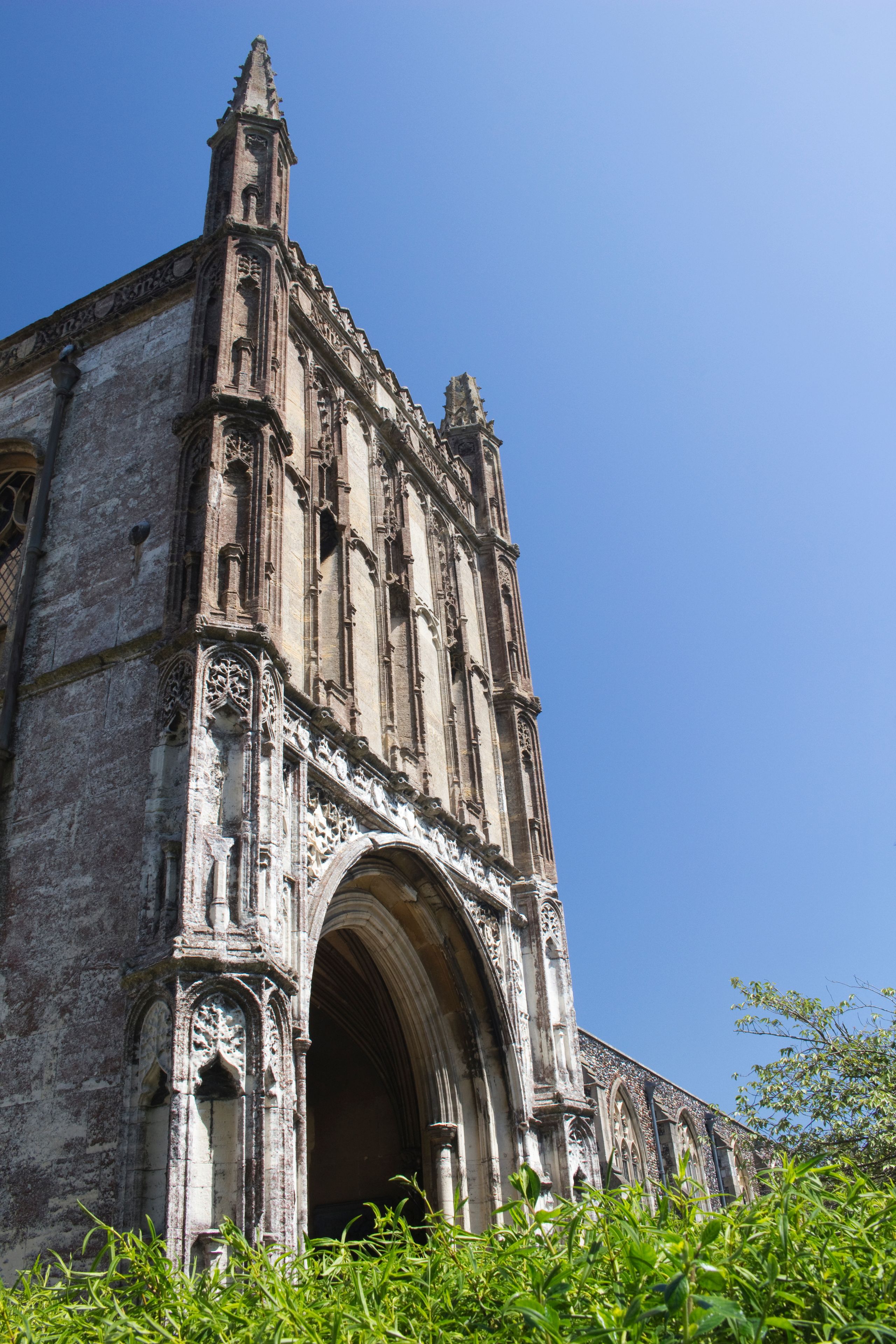A historic church with intricate stone carvings and a large arched entrance.