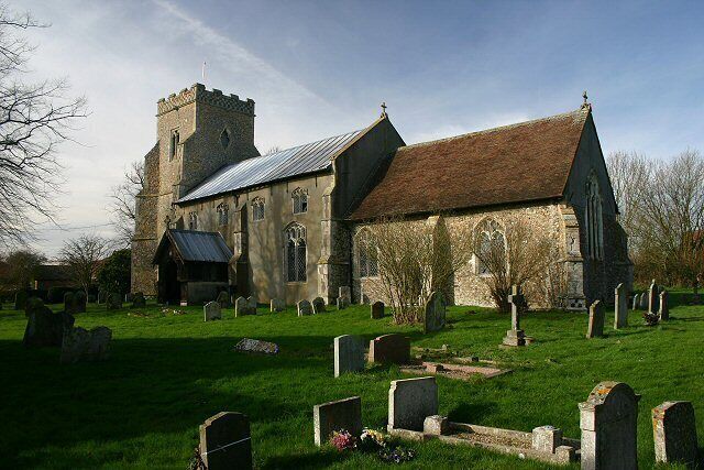 A church with a tower and a graveyard.