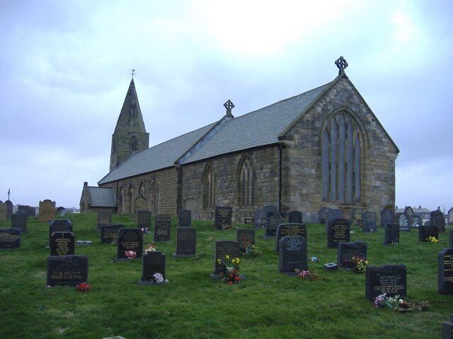 St Bartholomew's church, Newbiggin The modern gravestones in the foreground, are orientated towards the sea.