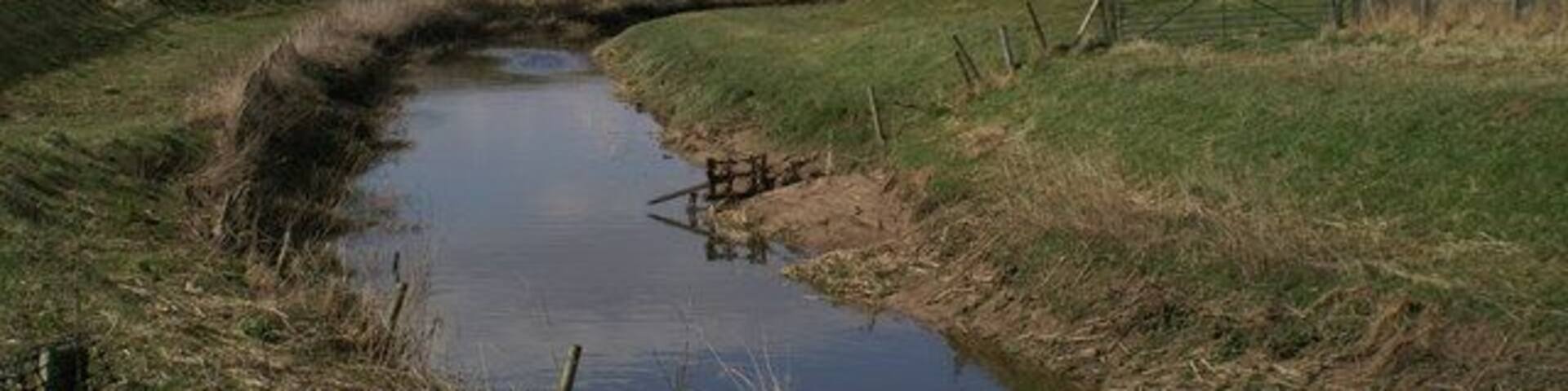The River Yarrow nears its end. After the River Lostock flows into it just round the bend, it joins the River Douglas about a mile away.
