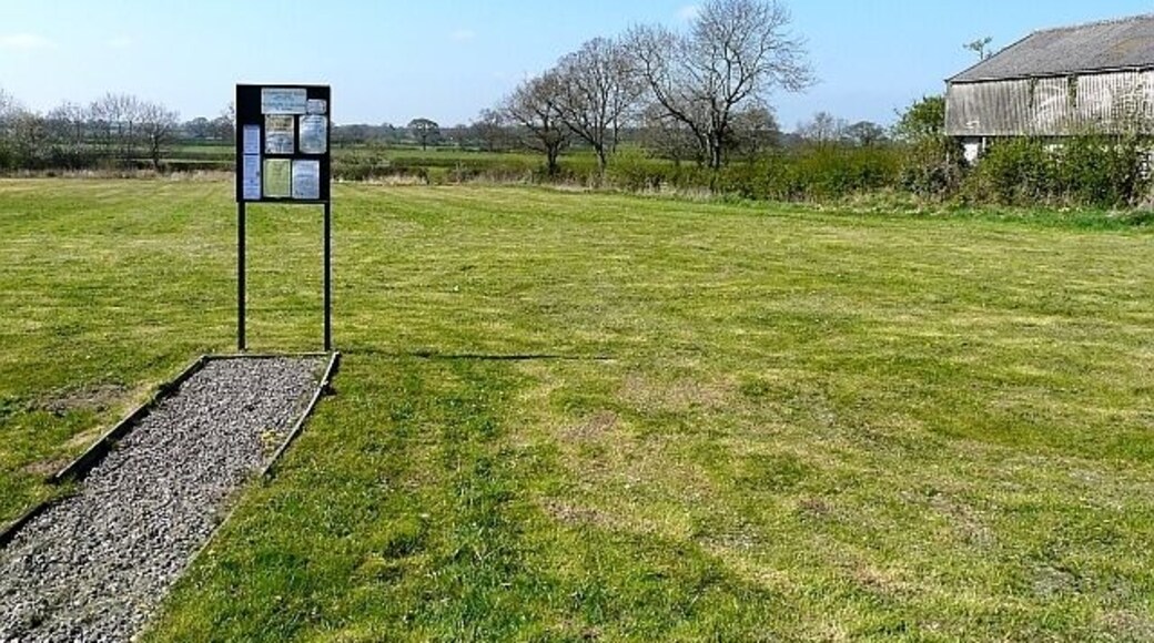 Brisco Common Green open space with a parish noticeboard. Brisco is in the administrative parish of St.Cuthbert Without.