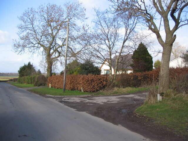 Low Burthwaite A view looking to the north towards Low Burthwaite and the entrance (right) to the track to Burthwaite Hill.